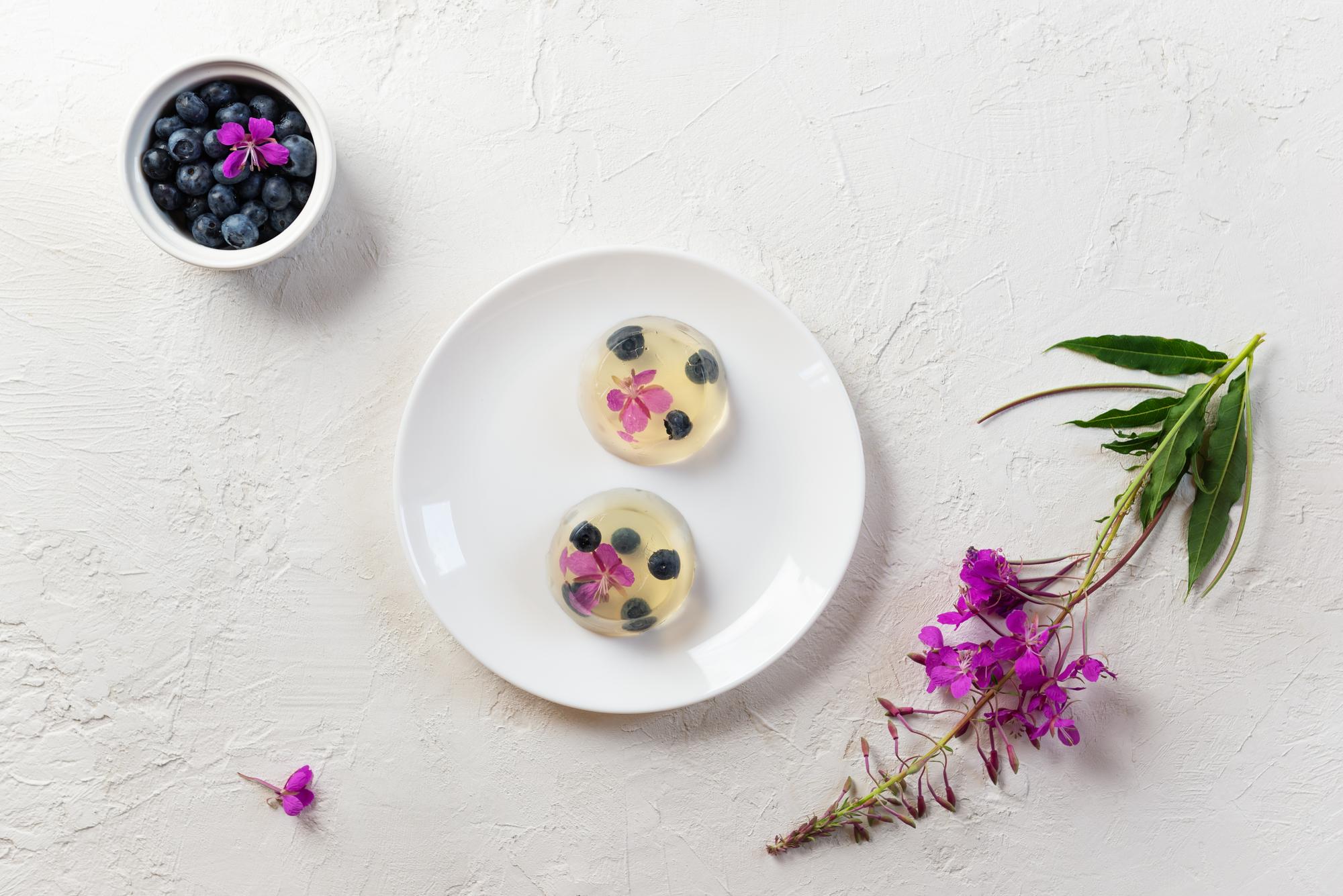 Minimal plated dessert with edible flowers